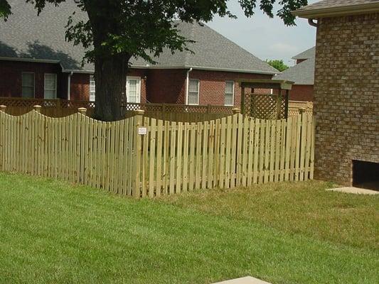 Wood picket fence w/scallop top and decorative post caps