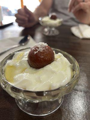Gulab Jamun w/yogurt: deep fried milk solids soaked in a sweet sauce with yogurt.