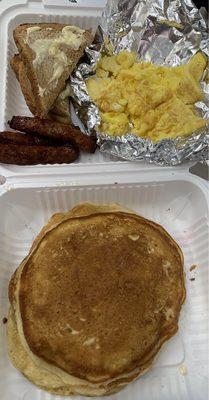 Pancakes, toast, sausage links, scrambled eggs.
