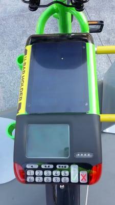 Enter your pass code here on back of bike and unlatch. When you are done, it summarizes your mileage and charge.