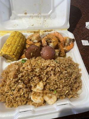 Lunch plate seafood and rice w/ ole miss seafood sauce over the top $10.00