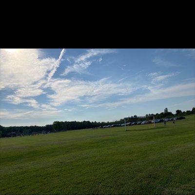 Soccer practice next to parking area