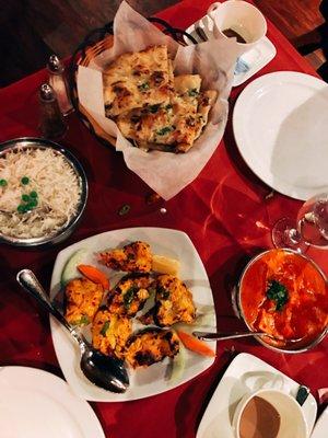 Garlic naan, rice, paneer tikka masala, and a chicken dish (I forget which)