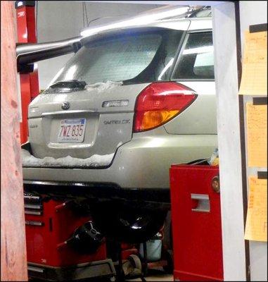 This is where you want your Subaru to be. Up on the lift at John's. You can count on getting the best care.