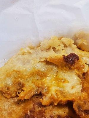 Pork and cheese pupusa more like Raw dough on the ends with what was left of the cheese that didn't spill on the grill.