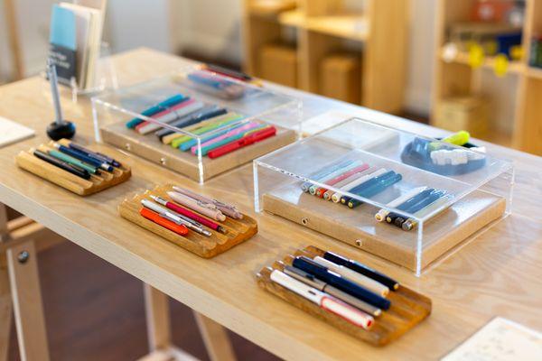 Try out pens, pencils, and notebooks at our tester station.