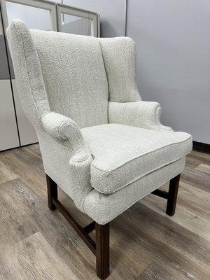 Chair repaired with new cushions and support.  Recovered with boucle fabric.