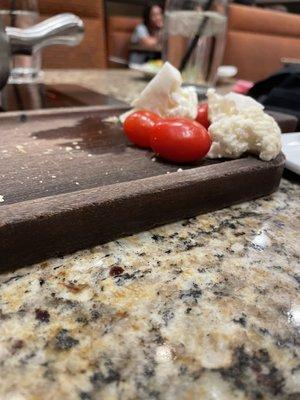 Tomatoes, raw cauliflower and two baby carrots for three people.
