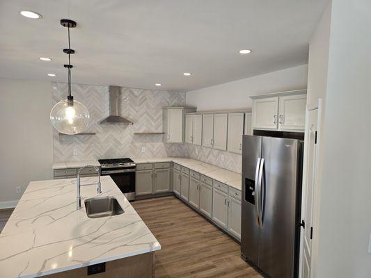 Added pendant lighting 6 recessed to this kitchen #2024
