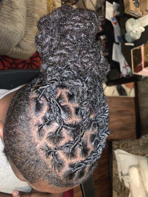 Retwist with two strand twist and barrel style. Two hair styles in one.