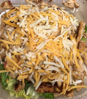 Grilled chicken salad served with side pita