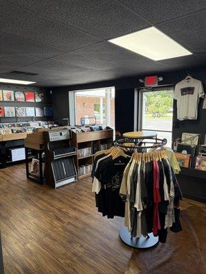 Another view of the entrance, new release bin and music related merch.