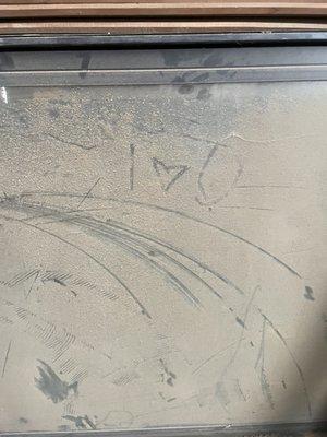 I u in saw dust. Found in the woodwork shop.