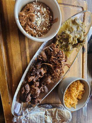 Tres cochinitos on a cutting board ... u still see cilantro on it they did not even wash it right