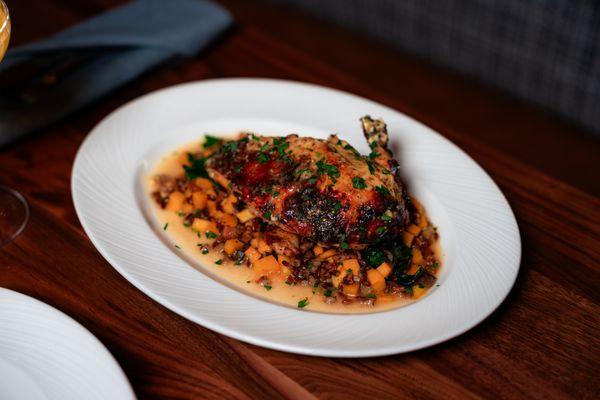 Boneless roasted all-natural half chicken, lemon-herb rub, leaf spinach, butternut squash and farro risotto