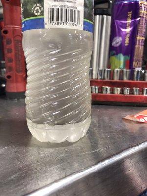 A sample of the gasoline BP sold me. The lower section is water. The tanks at this station leak.