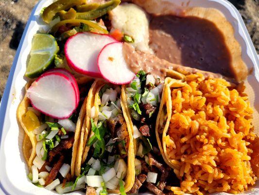 Taco plate ($14). Left to right: Al pastor, carnitas, carne asada. There's romaine salad in ranch beneath pickled jalapenos, upper left.