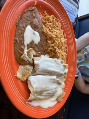 2 tamales, beans, and rice