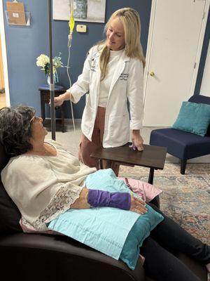 April McLemore, ARNP giving an IV infusion to a patient.