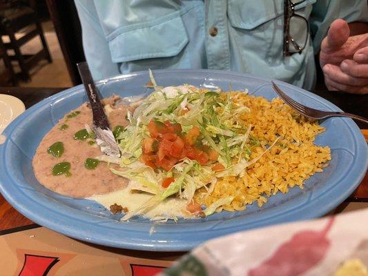 Beef burrito plate with refried beans, rice & salad.
