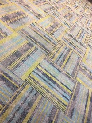 Avant-garde carpeting tiles grace the kiosk foyer.
