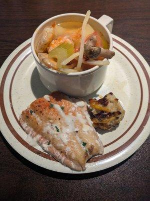 Seafood soup, baked salmon and sushi
