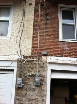 We installed a new 100 amp service on the house to the right.