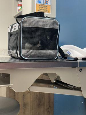 Waiting for his eye exam in the room.