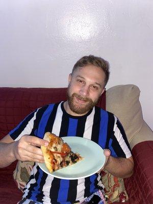 My hubby enjoying pizza