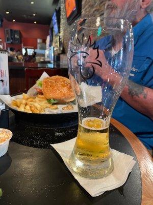 Buffalo chicken sandwich and beer