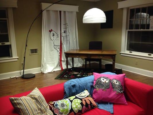 Couch with desk in background