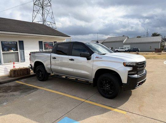 Window tint all the way around and top is wrapped in Super Gloss Black from 3M