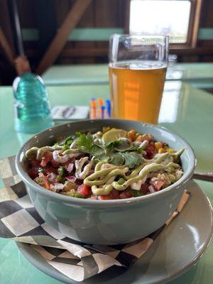 Quinoa bowl and beer inside.