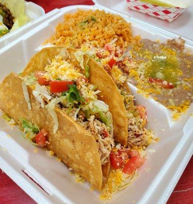 Friday's special, 2 tacos, rice and beans. Super Good