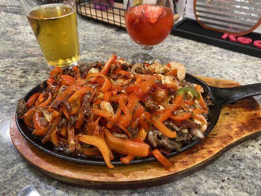 Mixed meat fajitas with cheese and in-house made tortillas