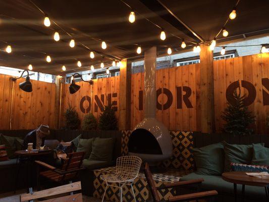 Outdoor patio with comfy seating. It looks indoorsy but be warned, it is open to the elements! Come here on a warm day.