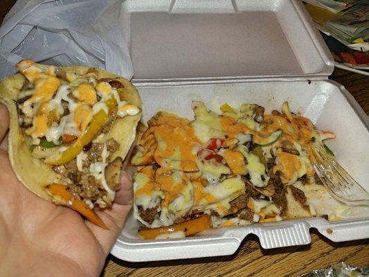 Carne asada alambres with both the red and green sauce on top. It is so delicious. Their homemade sauces, perfection!