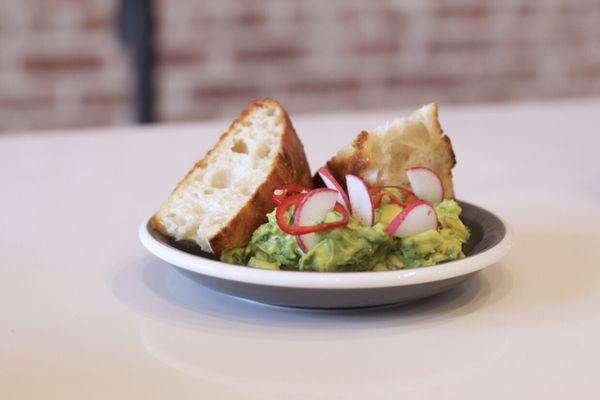 Chopped avocado w/ housemade focaccia. Pickled fresno chilies and radish.
