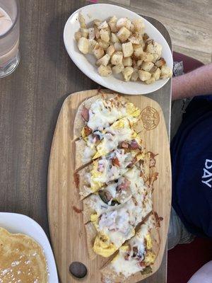 Breakfast pizza- the western. And a side of potatoes