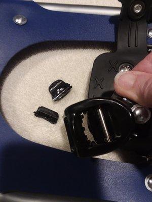 Broken quick release button on snowshoe.
