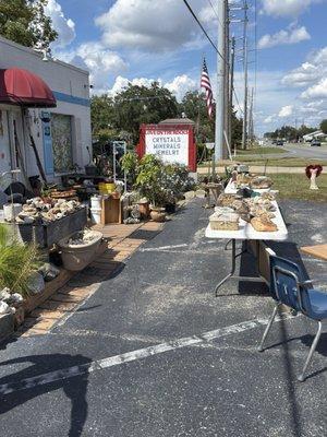 Rocks on display tables outside.