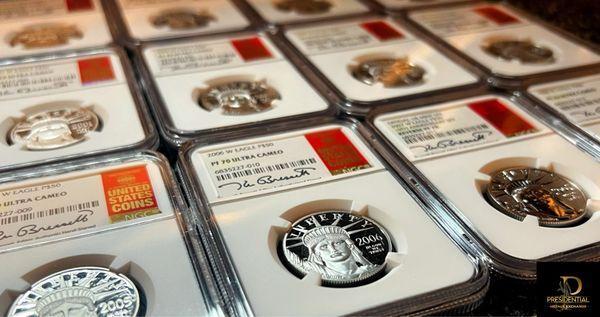Complete set of NGC PF70 $50 Platinum American Eagles. Signed by Kenneth Bressett.