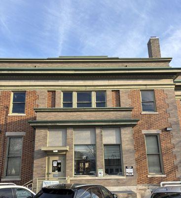 You can enter through the back entrance right off of the parking lot.