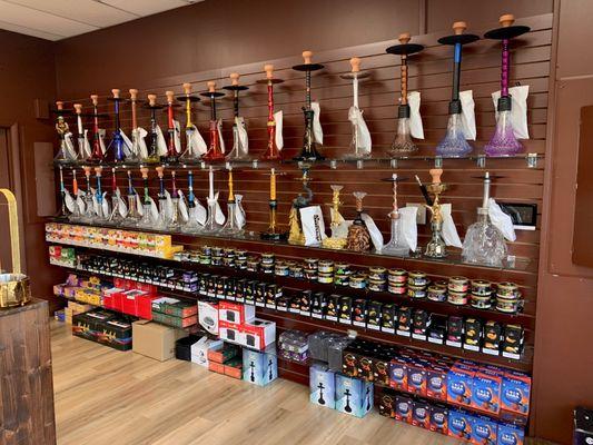 Our hookah wall showing off some of the selection of hookahs and our awesome shisha selection!