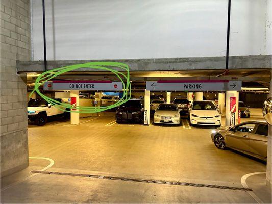 "Do not enter" sign on the left and "Larry", the valet parking finally moving the car (pictured on the right corner).