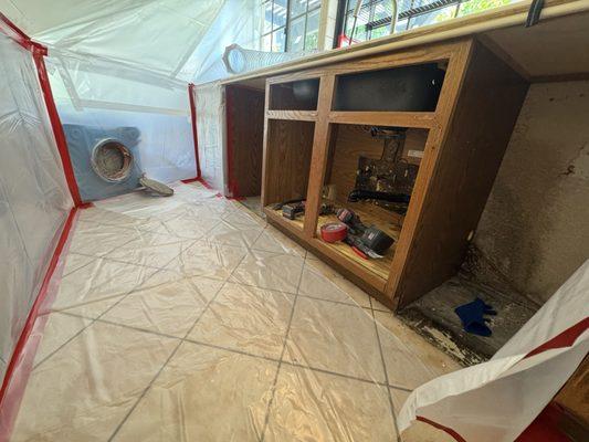 Kitchen sink area mold remediation from failed sink caulking allowing water to drip down