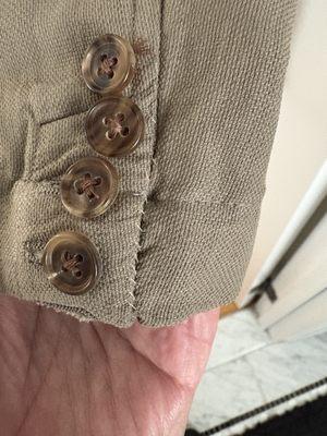 Horrible tailoring work. On an Hermes jacket!!!