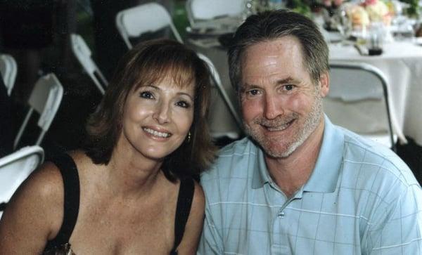 Larry with wife Kathleen. Storm cleanup in progress. Once spring blooms will have a photo of our building. Patience appreciated.