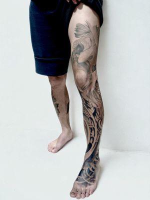 Leg sleeve tattoo in progress , with waves, plants, fish and other nature theme. It's also a cover-up tattoo.
