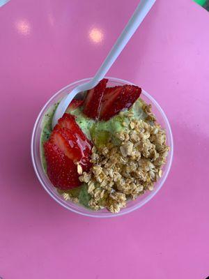 Green bowl with strawberries